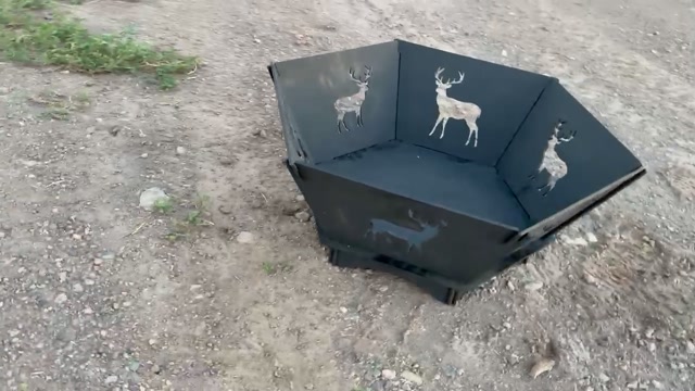 Portable steel fire pit with deer cutout panels