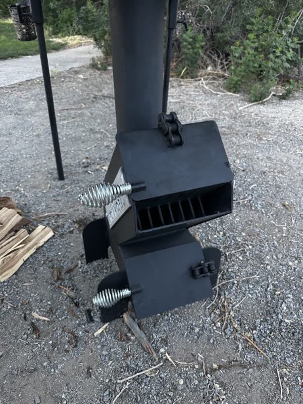Close view of Iron Rocket Stove firebox and chimney